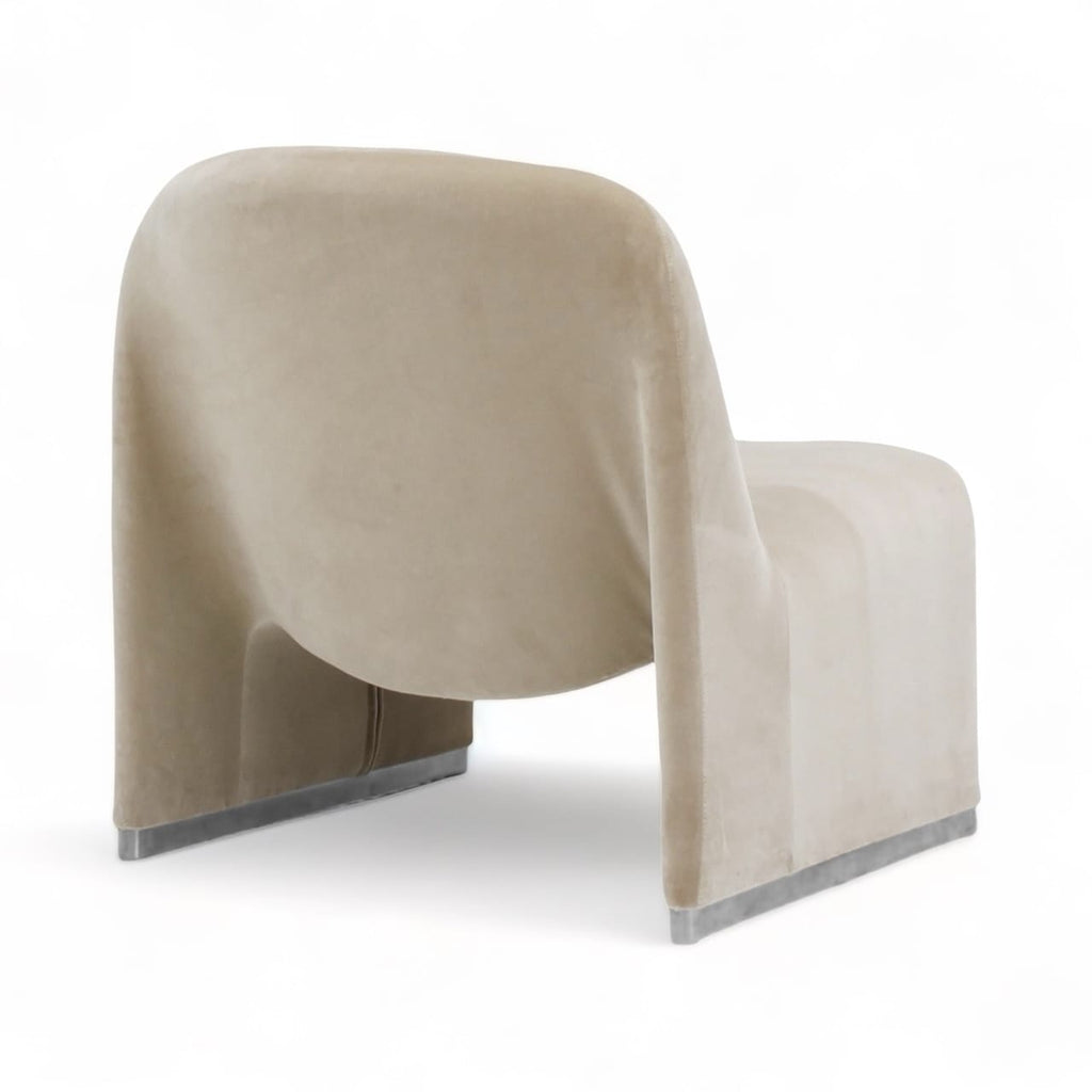 Alky Armchair upholstered in beige velvet, shown from an angled back view | Nue Modern