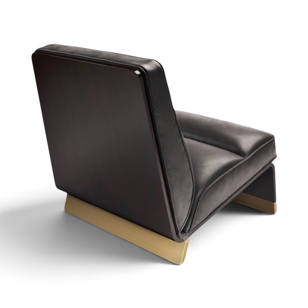 A modern low-profile lounge chair with dark brown leather upholstery and a light natural wood base, shown from a three-quarters angle on a white background.