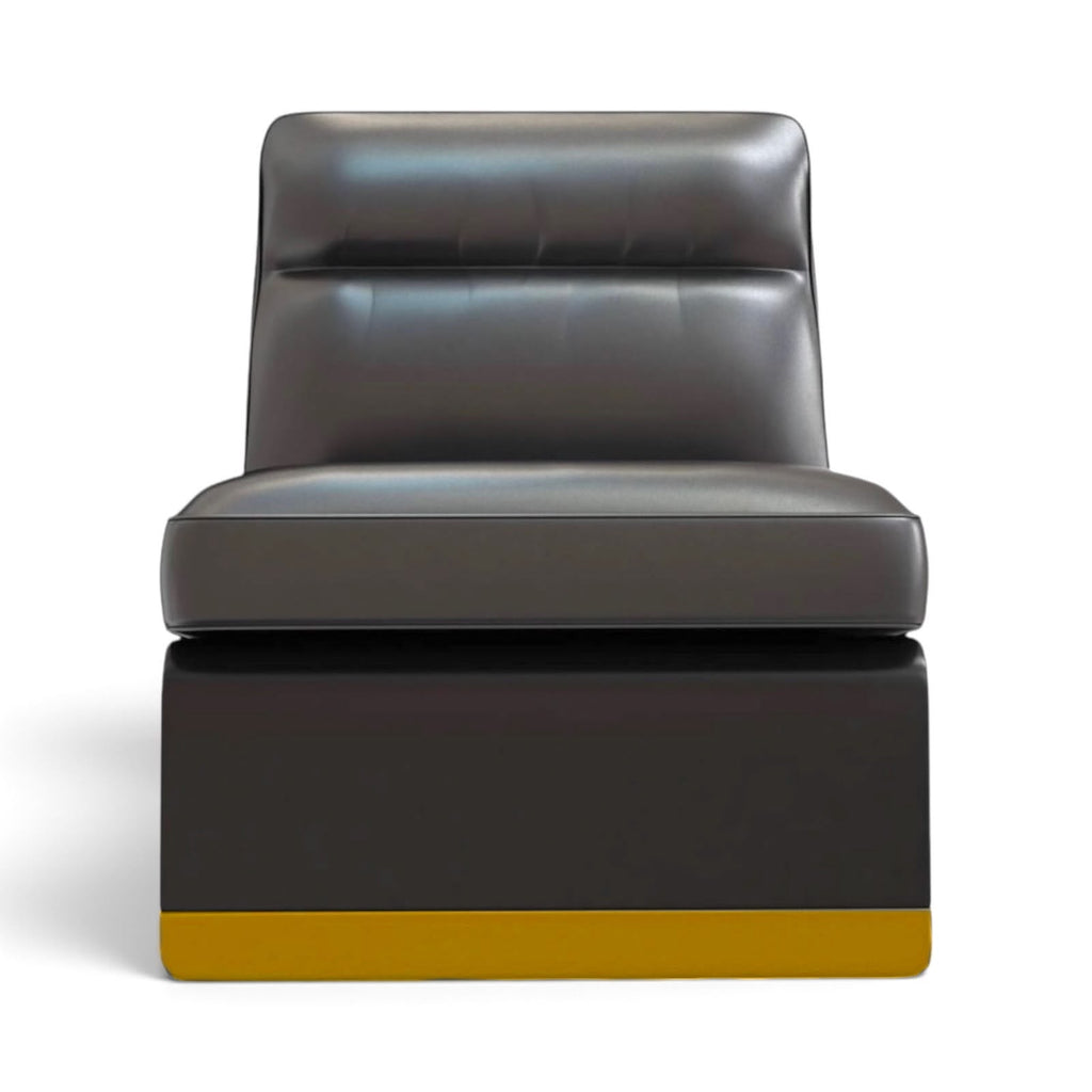 A modern low-profile lounge chair with a dark gray leather seat and backrest, supported by a dark base with a mustard yellow bottom trim, shown against a plain white background.