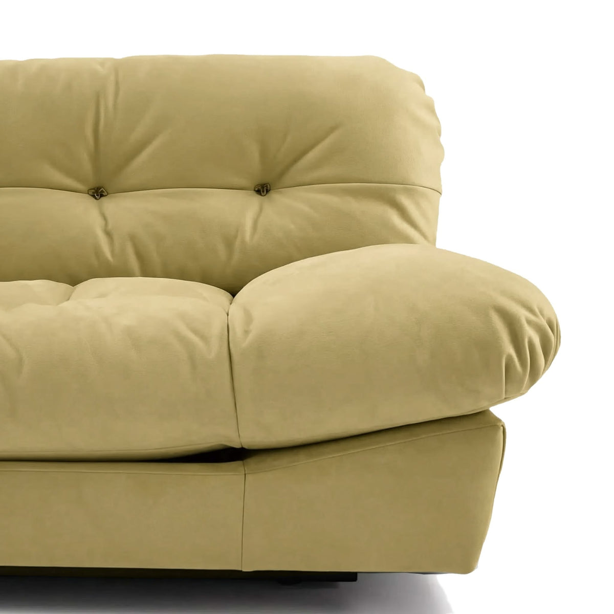 Close-up of a beige upholstered Milano sofa showing the tufted backrest, rounded armrest, and cushioned seat | Nue Modern