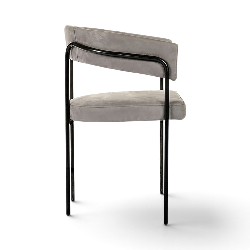 Side view of the C-Chair in light grey suede and black metal frame | Nue Modern