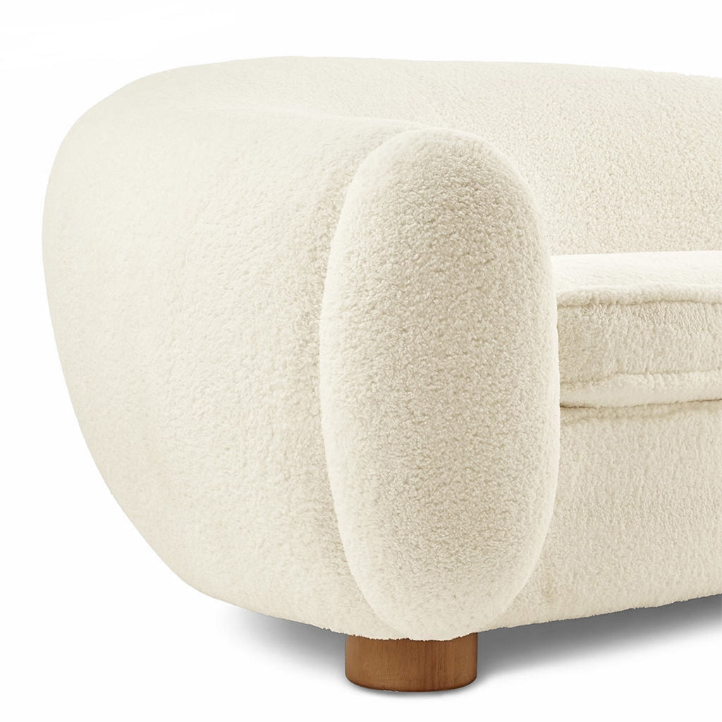 Close-up of the sherpa upholstery and curved arm seam on the Polar Bear Sofa | Nue Modern