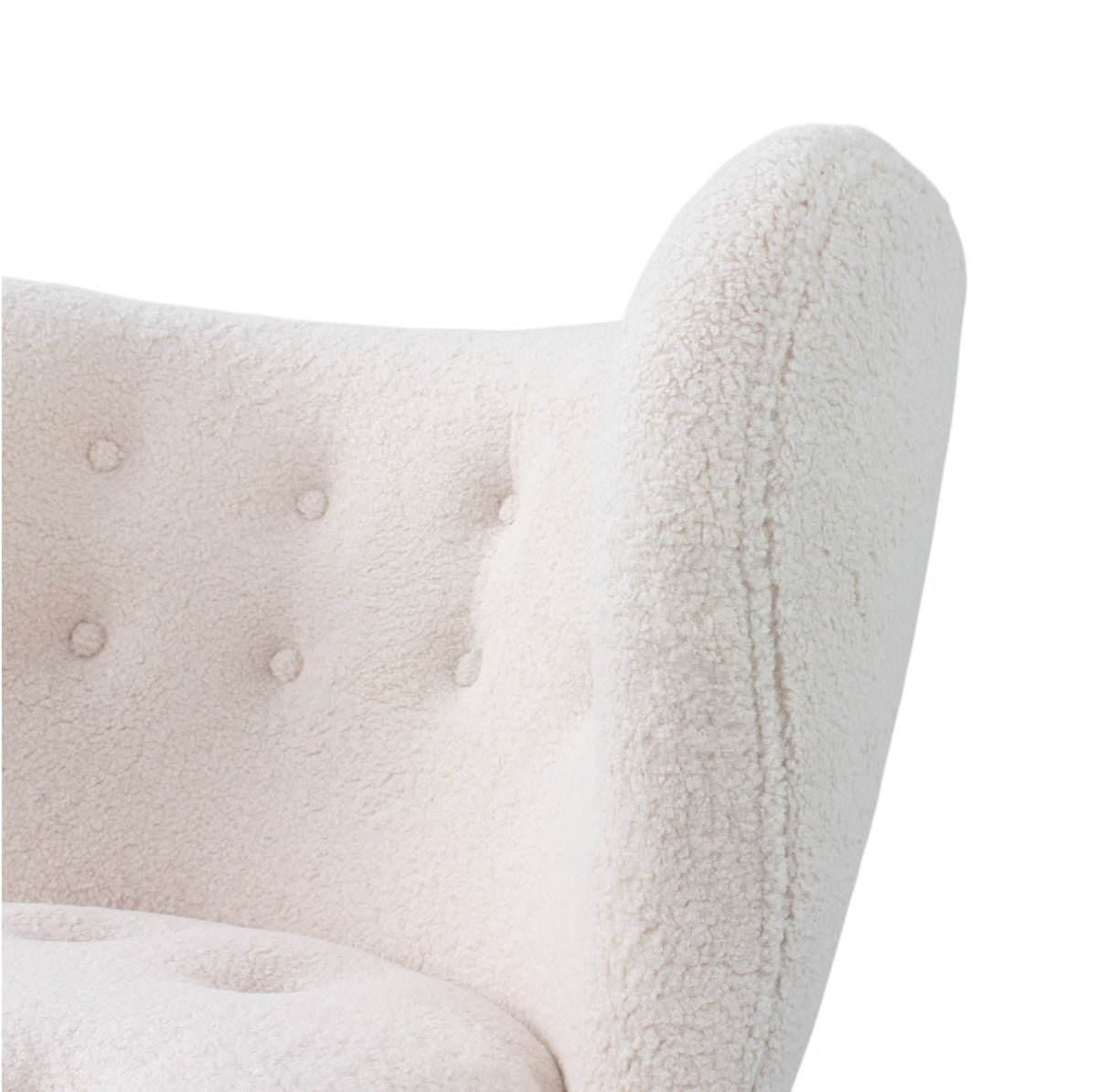 Close Up view of the tufted backrest of the Little Petra Chair | Nue Modern