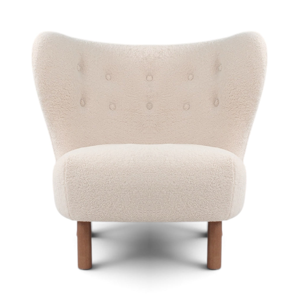 Front view of the Little Petra Lounge chair in a off-white Sherpa fabric with walnut legs | Nue Modern