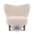 Front view of the Little Petra Lounge chair in a off-white Sherpa fabric with walnut legs | Nue Modern