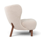 Little Petra Lounge chair with a textured cream upholstered shell and tapered walnut wooden legs | Nue Modern