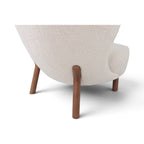 Close up back view showing the solid wooden walnut legs of the Little Petra chair | Nue Modern