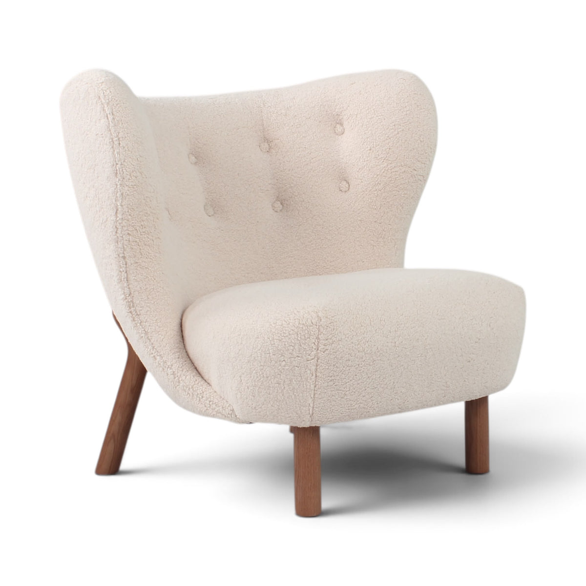 Little Petra chair upholstered in cream sherpa fabric with a tufted backrest and tapered wooden legs | Nue Modern