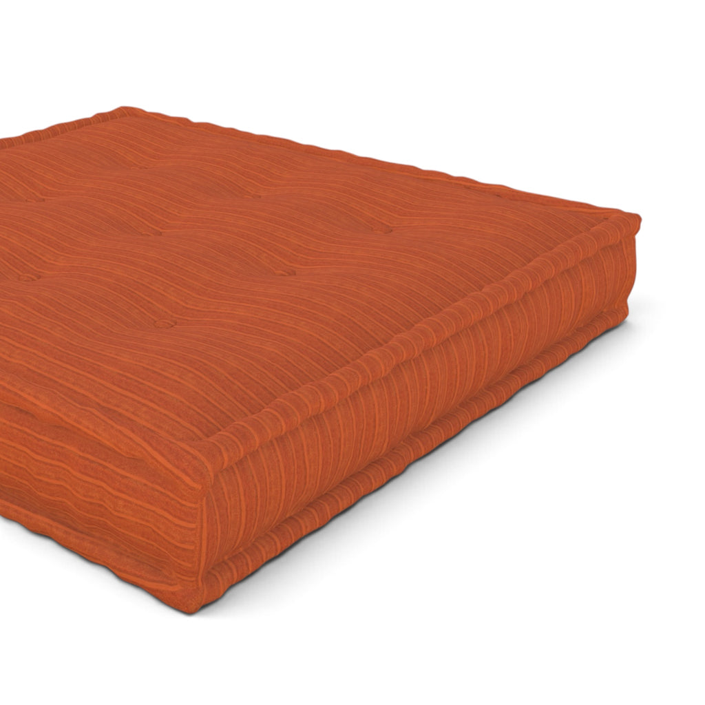 Mah Jong orange tufted floor cushion shown at an angle on a plain white background.