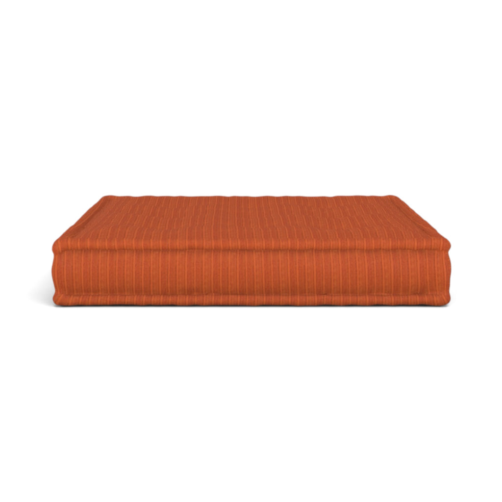 Mah Jong orange rectangular cushion with a fine vertical striped texture, shown against a plain white background.