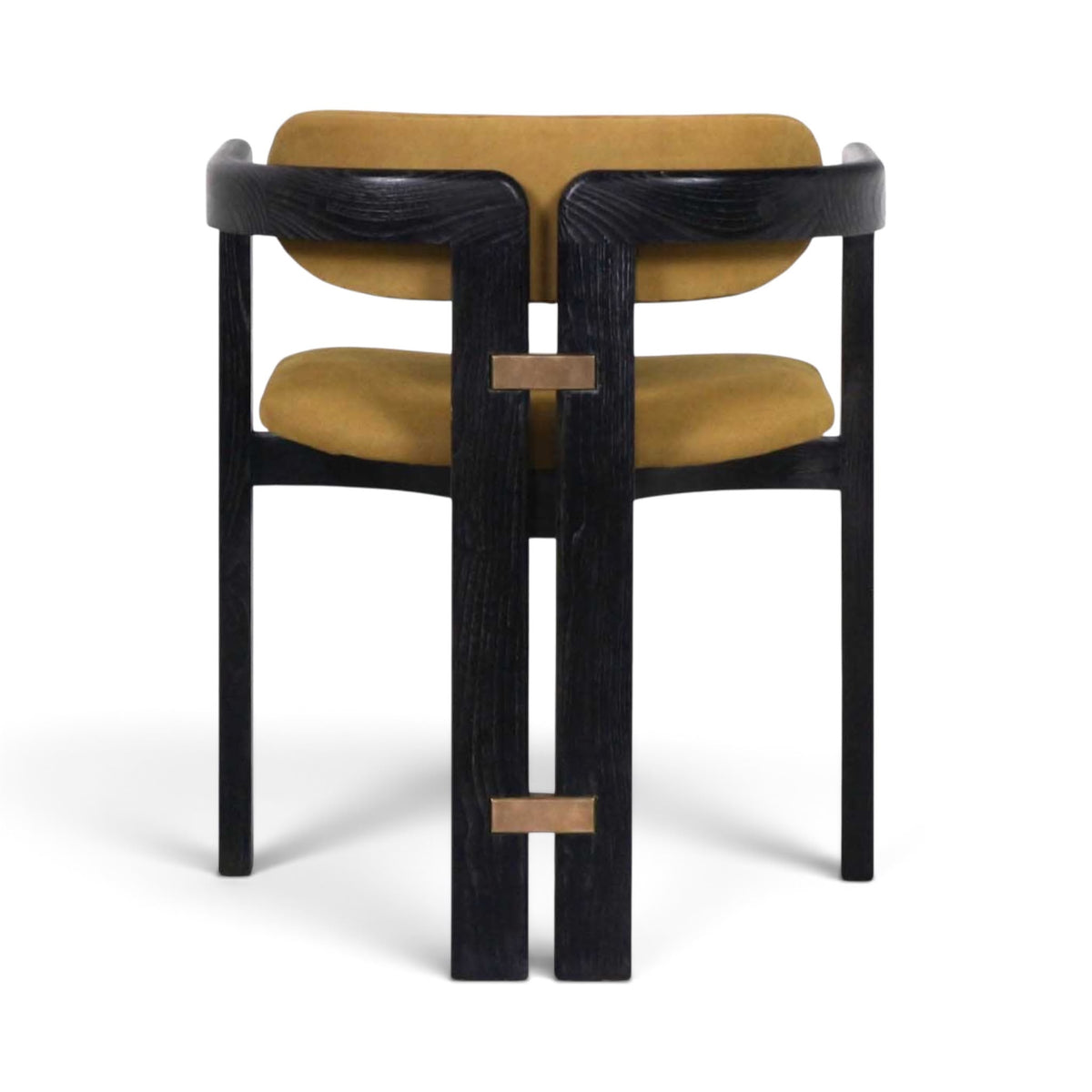 The Pamplona dining chair with a black wood frame and mustard yellow velvet upholstery, shown from the back | Nue Modern