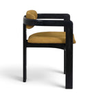 Side view of the Pamplona armchair with a black wooden frame and mustard yellow leather seat and back cushions | Nue Modern