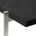 Detail view of the black marble and stainless steel base of the PK61 Coffee Table | Nue Modern