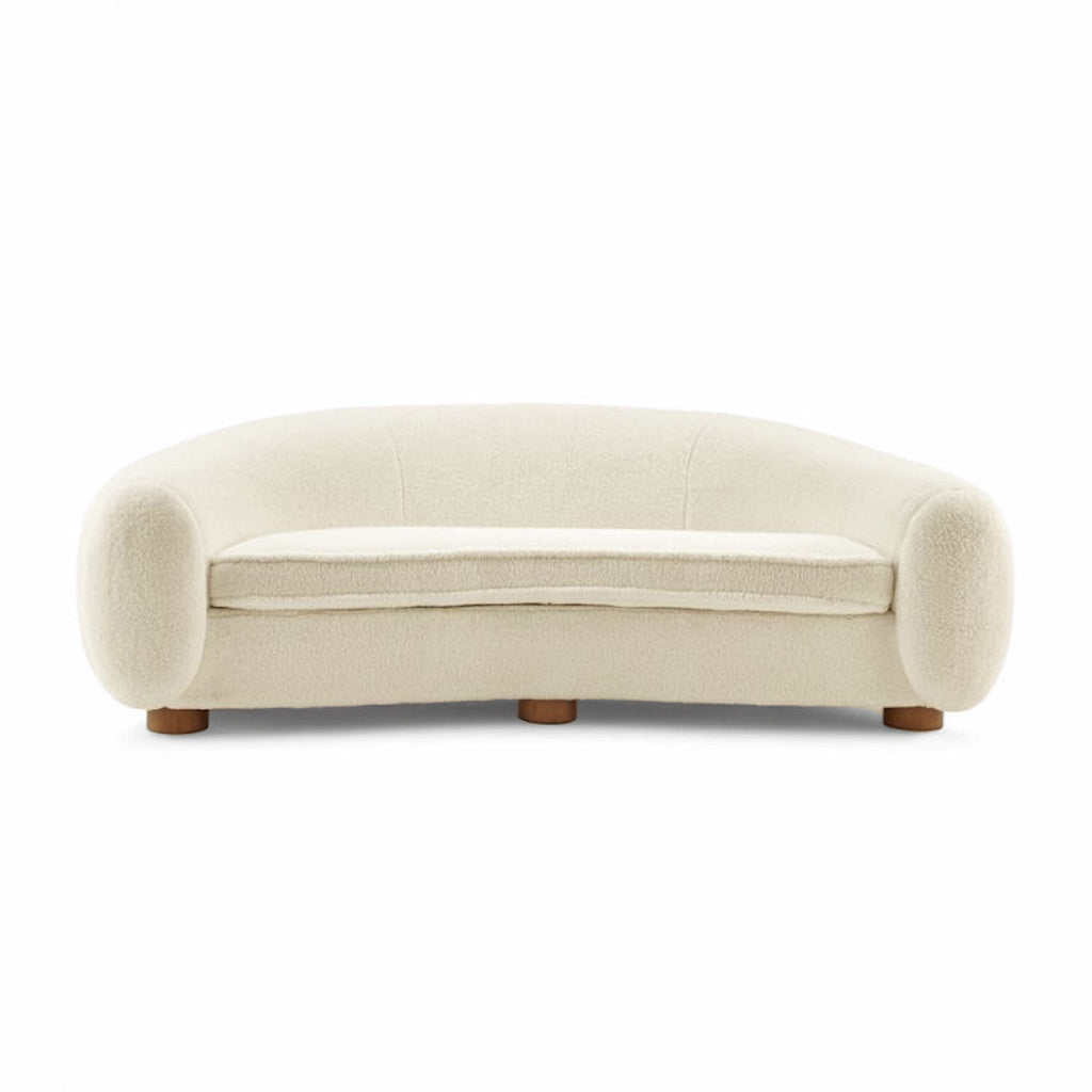 Polar Bear Sofa in cream sherpa, a curved three seater with rounded back and enveloping arms | Nue Modern