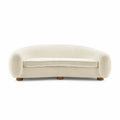 Polar Bear Sofa in cream sherpa, a curved three seater with rounded back and enveloping arms | Nue Modern