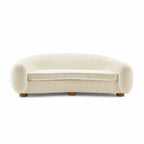 Polar Bear Sofa in cream sherpa, a curved three seater with rounded back and enveloping arms | Nue Modern