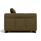 A modern upholstered armchair shown from the back, featuring a textured olive-brown fabric and a dark wooden footrest.