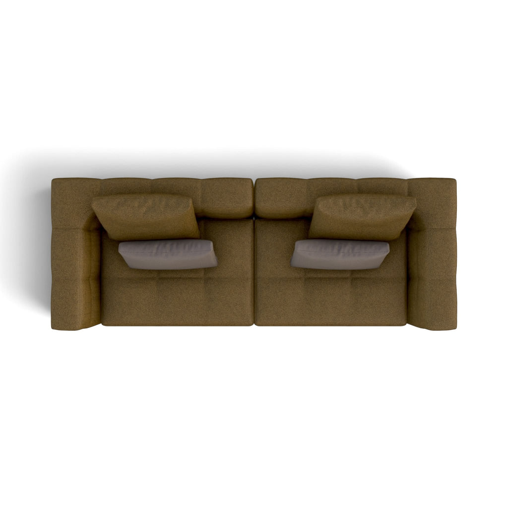 A top-down view of a modern modular sofa in a textured brown fabric, featuring two gray accent pillows, set against a plain white background.