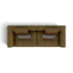 A top-down view of a modern modular sofa in a textured brown fabric, featuring two gray accent pillows, set against a plain white background.