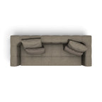A top-down view of a modern three-seater sofa in a textured taupe fabric, featuring two matching throw pillows, set against a plain white background.