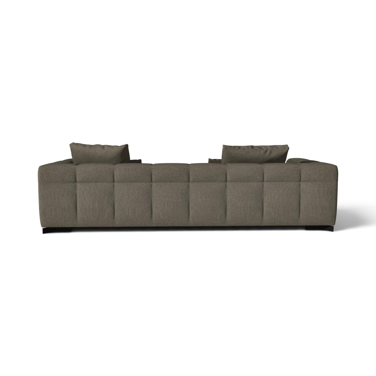 A modern low-profile sectional sofa upholstered in textured taupe fabric, featuring a tufted backrest and two matching throw pillows, shown from a straight-on perspective against a plain white background.