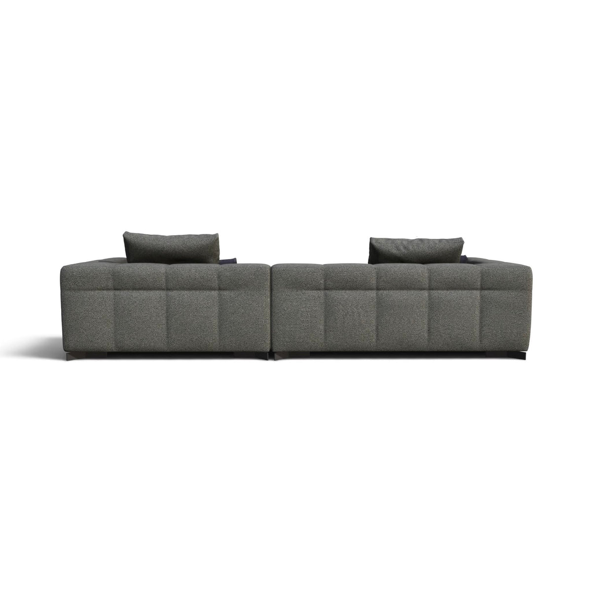 A modern modular sectional sofa in textured gray fabric with tufted square back cushions and two matching gray throw pillows, shown from a straight-on perspective against a plain white background.