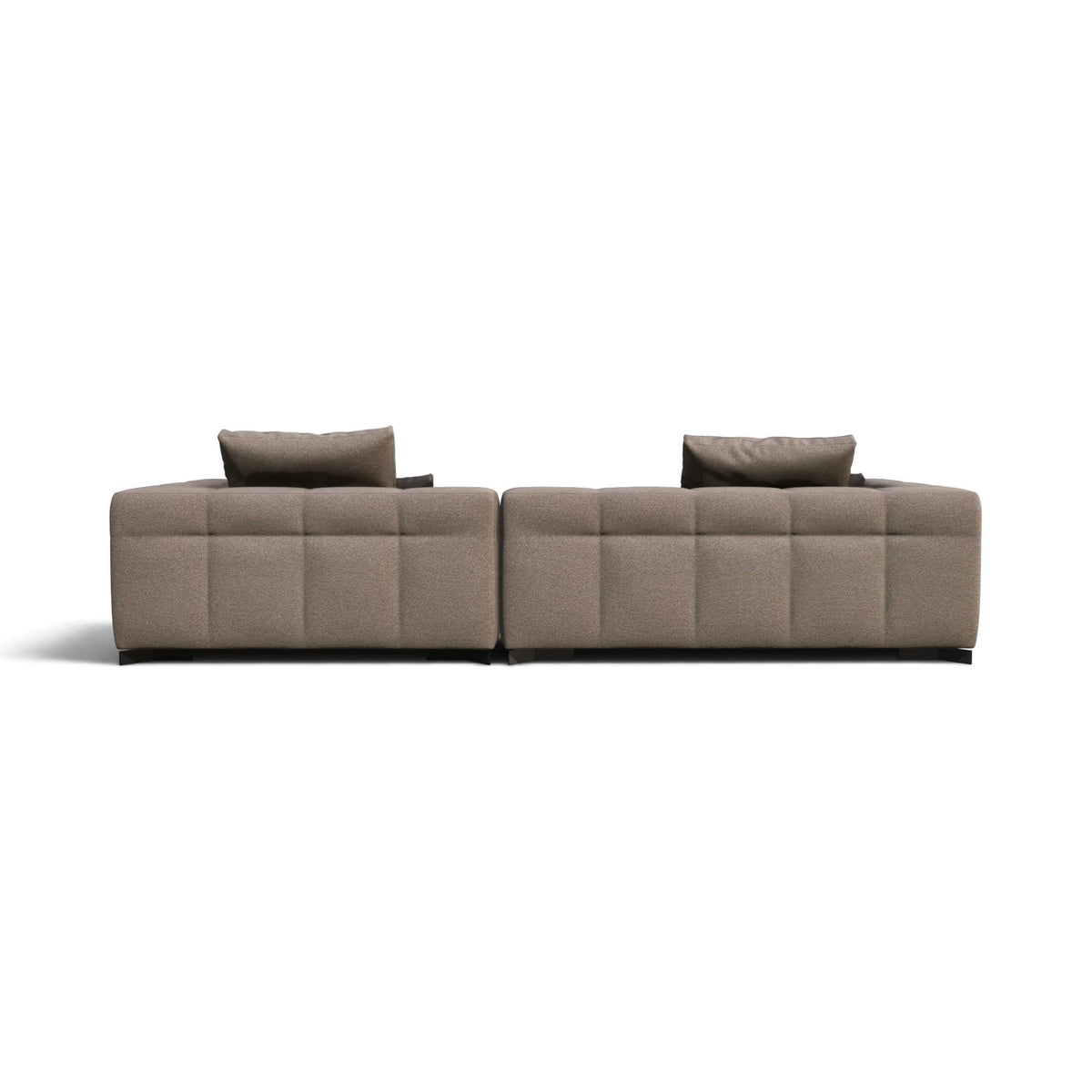 A modern modular sectional sofa upholstered in a textured taupe fabric, featuring deep channel tufting and two matching throw pillows, shown from a straight-on perspective against a plain white background.