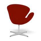 Swan Chair with a deep red upholstered shell and a chrome four-star base | Nue Modern