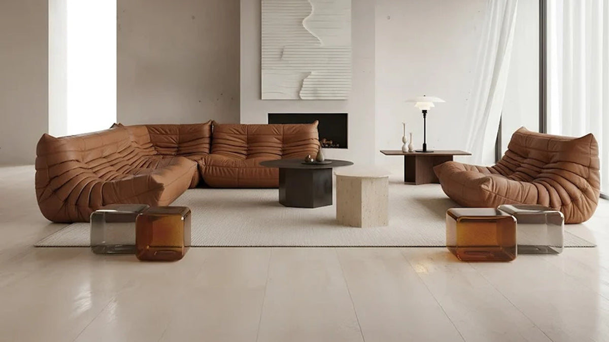 minimalist living room with tan leather Togo Sofa Set and marble coffee and side tables | Nue Modern