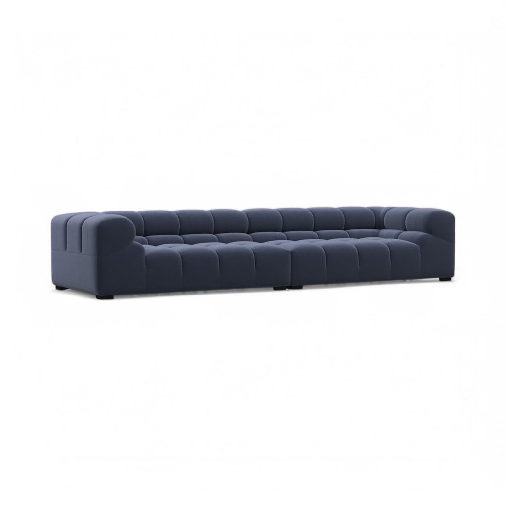 Front angled view of the Tufty Large 3-Seater Sofa in blue velvet | Nue Modern