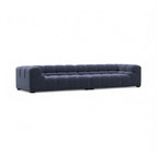 Front angled view of the Tufty Large 3-Seater Sofa in blue velvet | Nue Modern