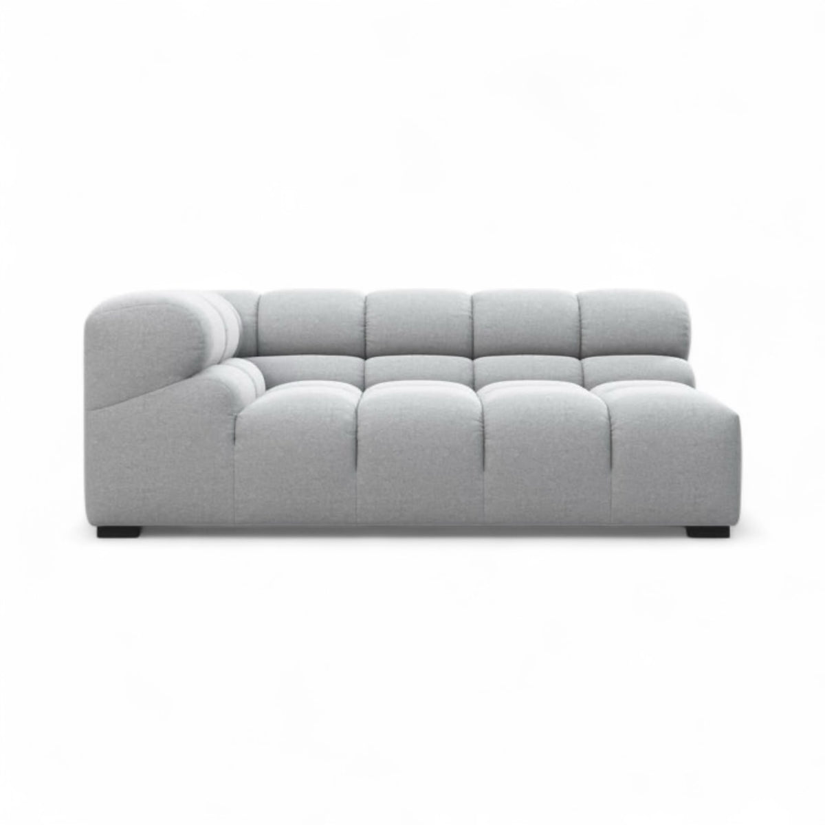 A modern light gray tufted sectional sofa with a right-facing armrest, shown from a front-facing perspective on a solid white background.