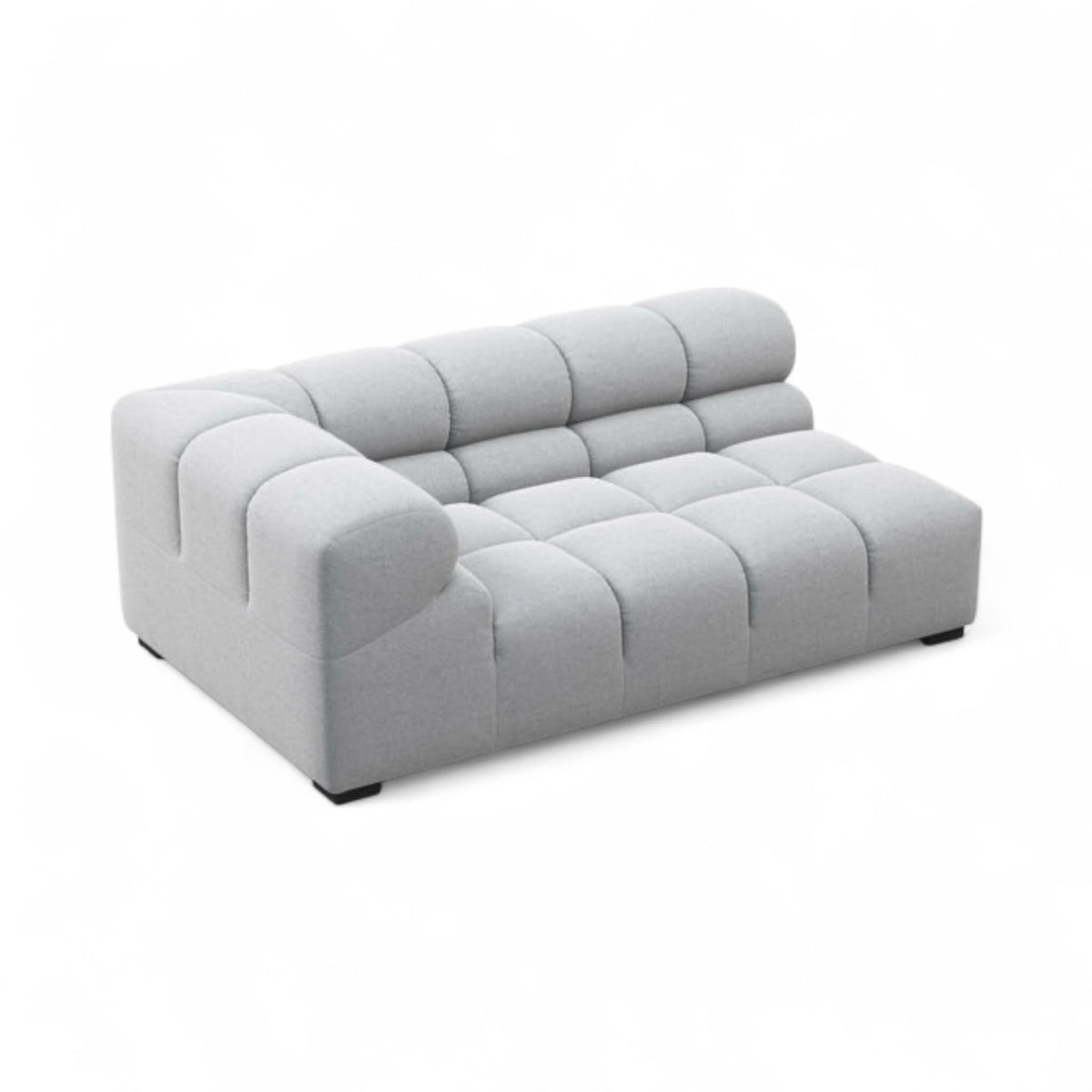 A modern light gray tufted modular sofa or lounge chair with a low, rounded blocky design, shown on a plain white background.