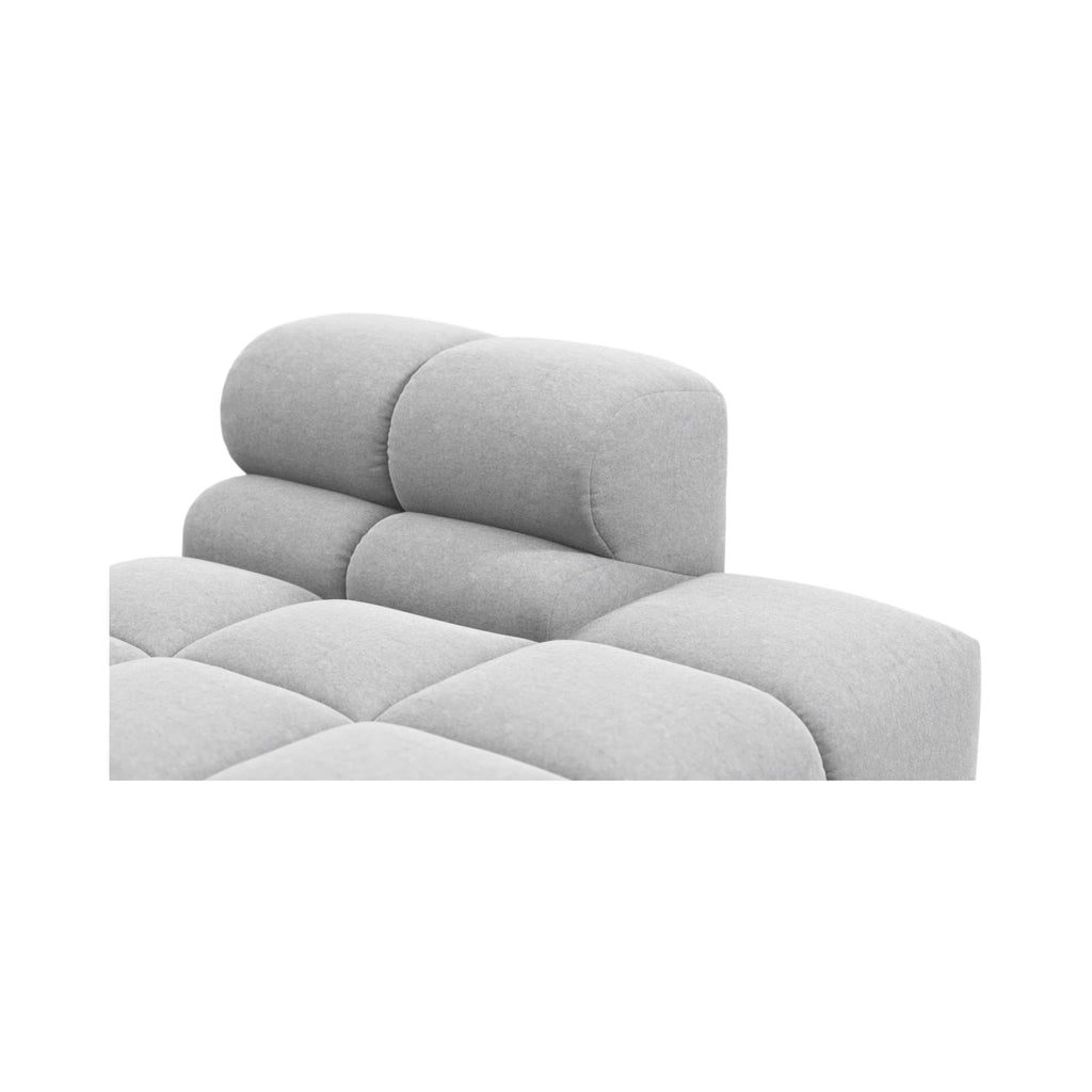 Close-up of a light grey tufted upholstered Tufty TF018 on a plain white background.