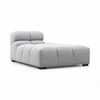 Grey upholstered Tufty TF018 in a three-quarter view on a white background